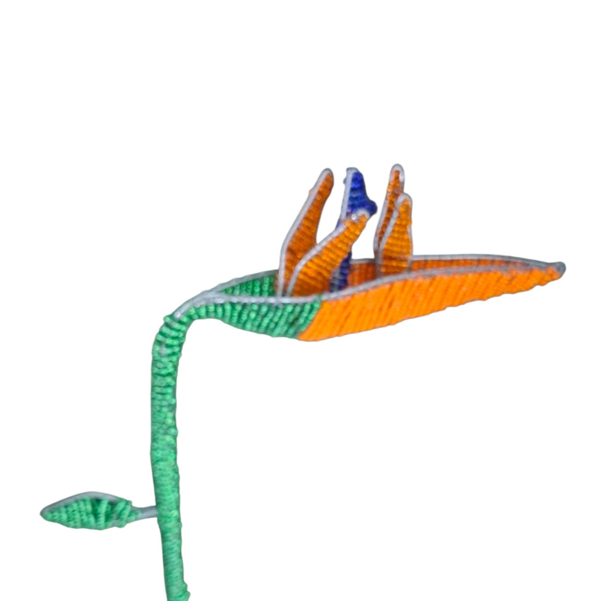 Colorful fishing lure with a green body and orange wings on a white background