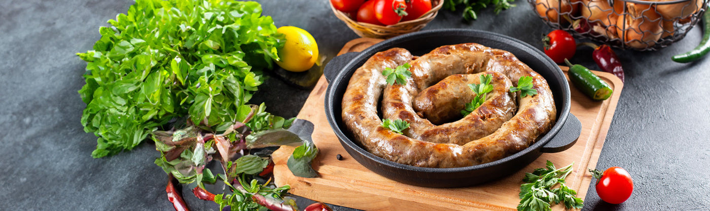 Boerewors cooked in a cast iron pan