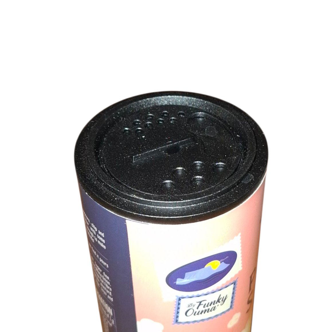 Close-up of the lid of popcorn sprinkle from Biltong Direct on a white background