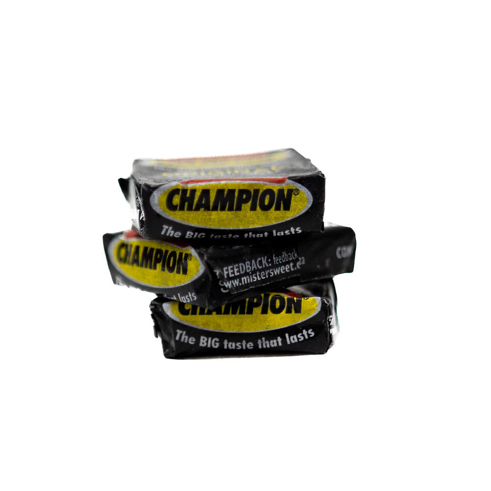 A stack of Black and yellow candy wrappers labeled 'Champion original flavoured Toffee'. from Biltong direct