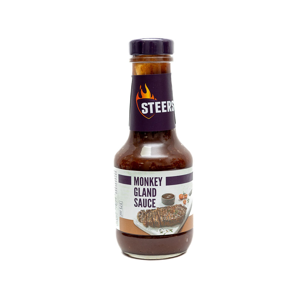 375ml bottle of Steers Sauce - Monkeygland from Biltong Direct with a purple cap, label visible showing the product name and some sauce particles in the background.