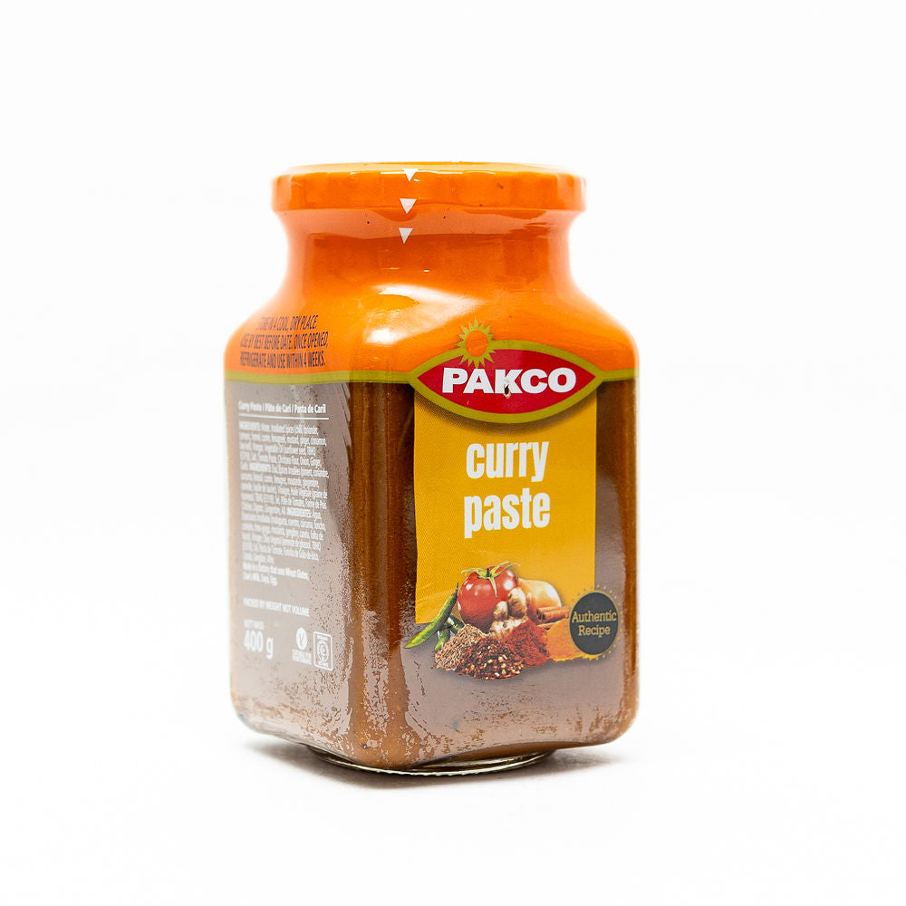 A jar of Pakco Curry Paste, 400g from Biltong Direct. The label shows the brand name 'Pakco' and the product name 'curry paste'.