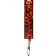 A pair of LK's branded braai tongs from Biltong Direct with a red handle , displayed against a packaging background with fire graphics.