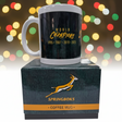 Green coffee mug with 'World Champions' text on a box with Springboks logo, colorful lights in the background
